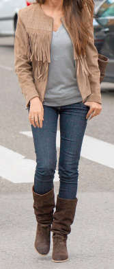 Fringed jacket, jeans and high boots