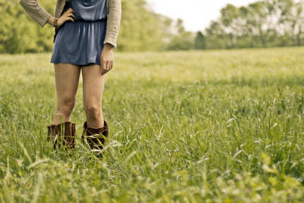 Modern hippie casual girl on the grass
